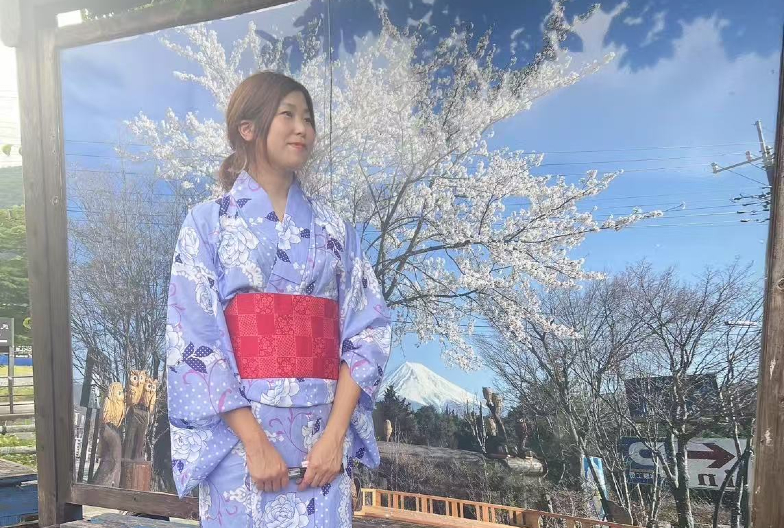 Couple wearing yukata in a Japanese garden.